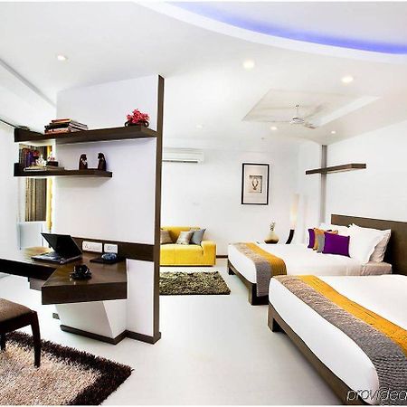 Melange Astris Aparthotel Bangalore Quarto foto